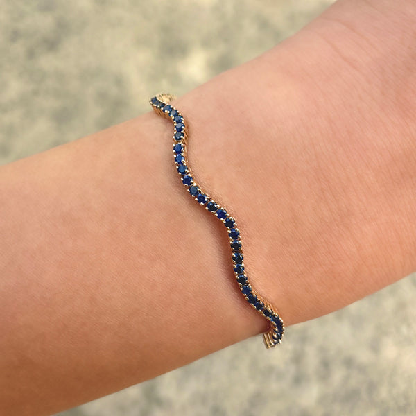14K GOLD BLUE SAPPHIRE WAVE TENNIS BRACELET